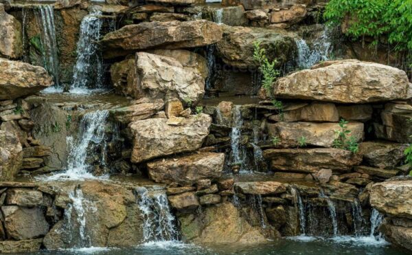 landscape-design-a-dam-with-a-cascade-of-waterfalls-in-the-form-of-natural-rocks-photo